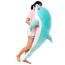 Load image into Gallery viewer, girl hugging giant blue dolphin plushie