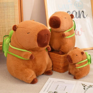 Adorable capybara plush toys with tiny green backpacks, available in multiple sizes! Perfect for cuddles, décor, or gifting to capybara lovers.