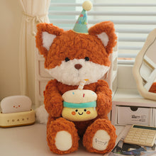 Load image into Gallery viewer, Cute orange fox plushie with a birthday hat and cake on a desk