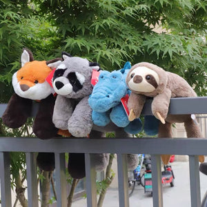 A collection of cute animal plushies sunbathing in the streets of London