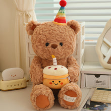 Load image into Gallery viewer, Plush teddy bear with a birthday cake and candle, sitting on a desk.