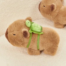 Load image into Gallery viewer, mini capybara plushie carrying a tortoise plushie