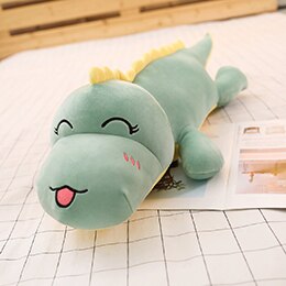 green dinosaur plushie with tongue out