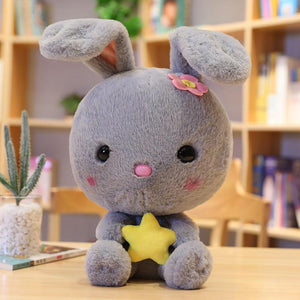 Cute grey bunny plushie with a yellow star to brighten up your day!
