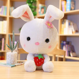 Cute and hairy white rabbit plushie with a strawberry!