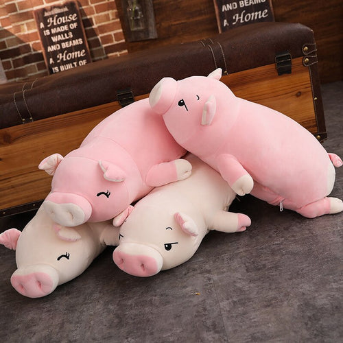 family of pig plushies