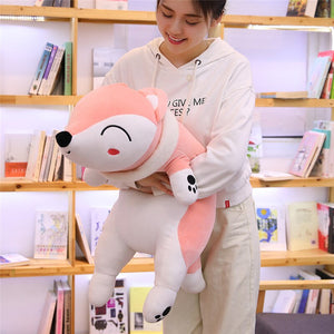 girl hugging pink fox plushie