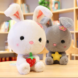 Cute and hairy white rabbit plushie with a strawberry!