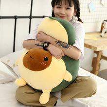 Load image into Gallery viewer, girl hugging avocado plushie