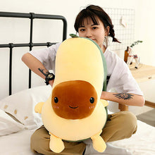 Load image into Gallery viewer, girl playing with avocado plushie