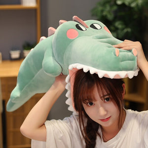 green alligator/crocodile plushie on girl's head