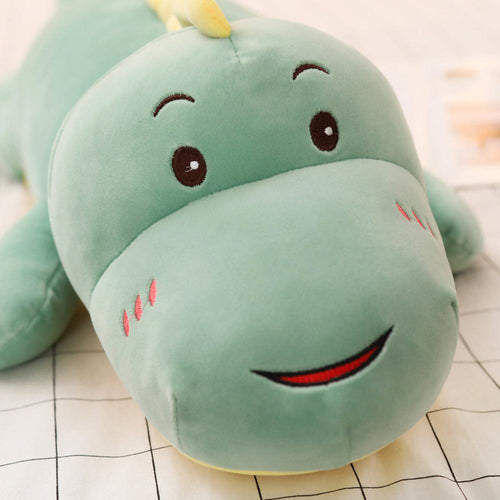 green smiling dinosaur plushie