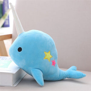 cute deep blue narwhal whale unicorn in the sea with star plush toy