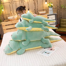 Load image into Gallery viewer, green dinosaur plushies stacked up
