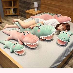 family of pink and green crocodile/alligator plushies